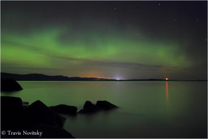 Northern lights moonrise over Wauswaugoning Bay by Travis Novitsky